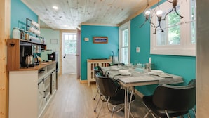 A kitchen with a dining table, chairs, and a view of the outdoors. - River Views & Boat Launch Access: Huntingdon Home (Huntingdon)