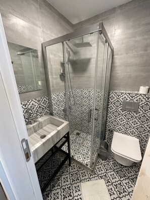 Shower, hair dryer, towels, soap