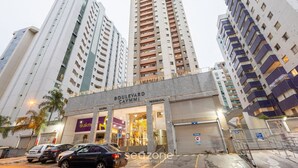 A multi-story building with a commercial ground floor labeled "Boulevard Caymmi" and "Galeria." - Luxury Penthouse w/ Jacuzzi in Brasilia Bcy2001 (Águas Claras)