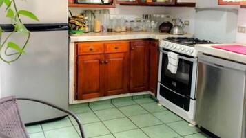 Family Triple Room, Multiple Beds | Private kitchen | Shared fridge, microwave