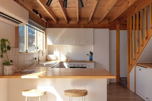 Fridge, electric kettle, cookware/dishes/utensils