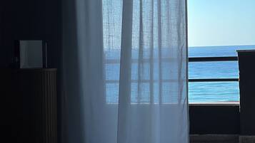 Junior Suite, Balcony, Sea View | Desk, laptop workspace, blackout drapes, soundproofing