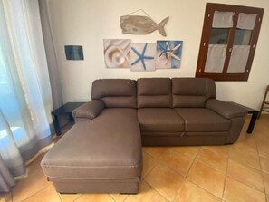 Apartment, 4 Bedrooms, Balcony, Garden View | Living area - Villa Praga San Teodoro (San Teodoro)