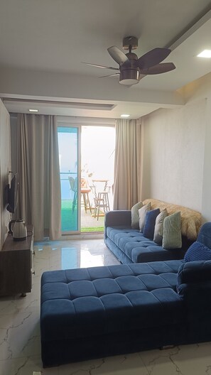Deluxe Apartment, Balcony, Sea View | Living area