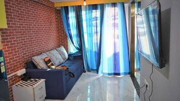 Familienapartment, Balkon, Meerblick | Wohnbereich