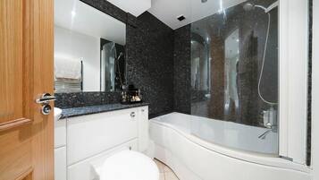 Combined shower/tub, deep soaking tub, hair dryer, towels