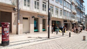A street view with a building labeled 'Normal' and a red mailbox.