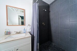 Shower, hair dryer, towels, soap