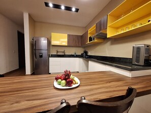 Fridge, microwave, stovetop, coffee/tea maker