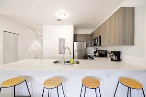 Basic Townhome, 3 Bedrooms, Patio | Private kitchen | Fridge, microwave, oven, stovetop - Prime Townhouses Near Design District (North Miami Beach)