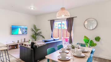 Basic Townhome, 3 Bedrooms, Patio | Living area | 60-inch flat-screen TV with cable channels