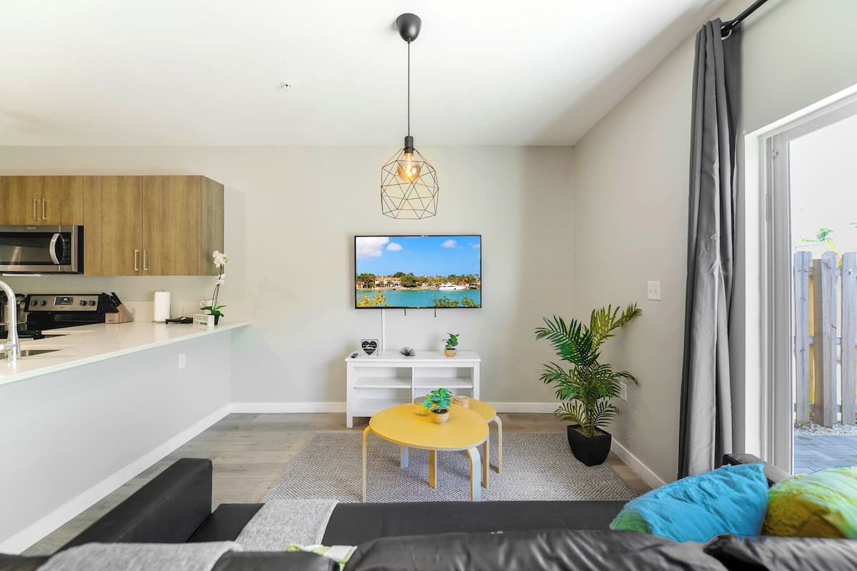 Family Townhome, 3 Bedrooms, Patio | Living area | 60-inch flat-screen TV with cable channels