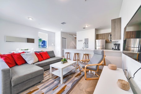 Family Townhome, 3 Bedrooms, Patio | Living area | 60-inch flat-screen TV with cable channels