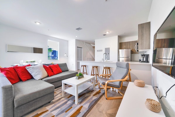 Family Townhome, 3 Bedrooms, Patio | Living area | 60-inch flat-screen TV with cable channels