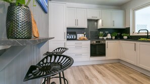Fridge, microwave, oven, high chair