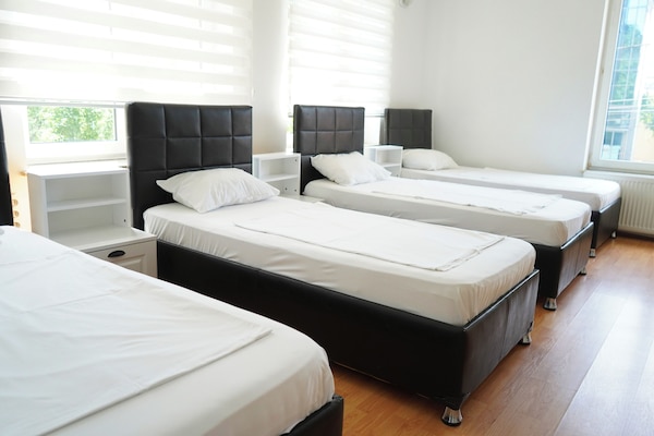 Quadruple Room, Garden View | Iron/ironing board, free WiFi