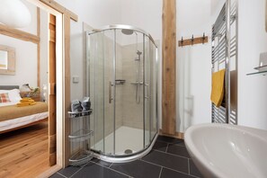 Shower, hair dryer, towels, toilet paper