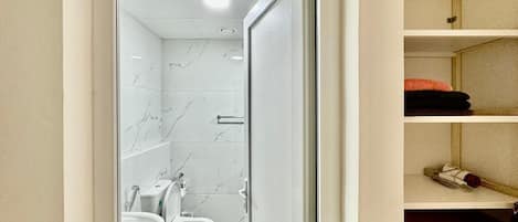 Shower, hair dryer, towels, soap