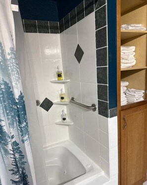 Jetted tub, eco-friendly toiletries, hair dryer, towels