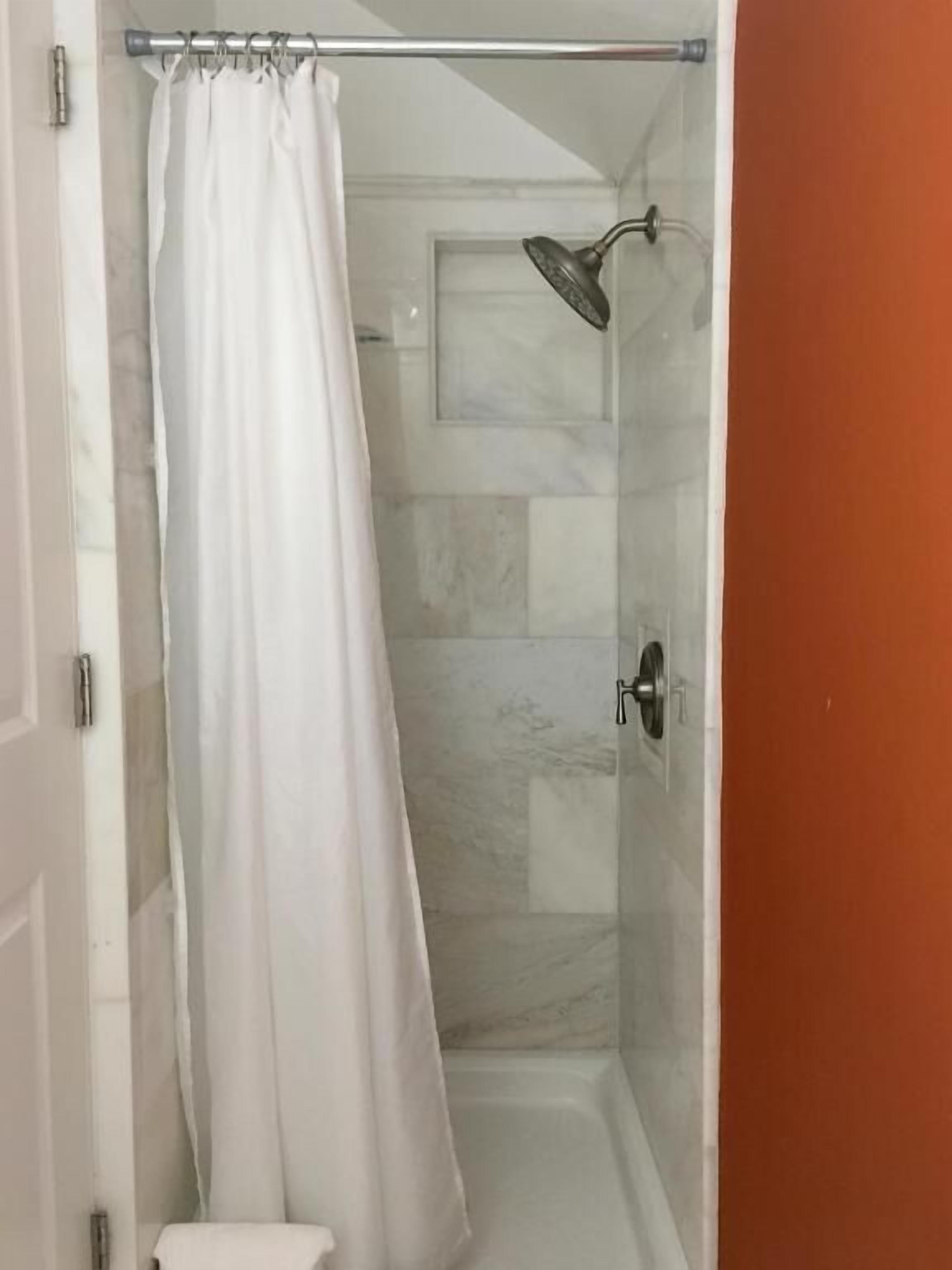 Shower, hair dryer, bathrobes, towels