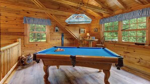 A wooden cabin with a pool table, a staircase, and large windows. - Leconte Lookout (Sevierville)