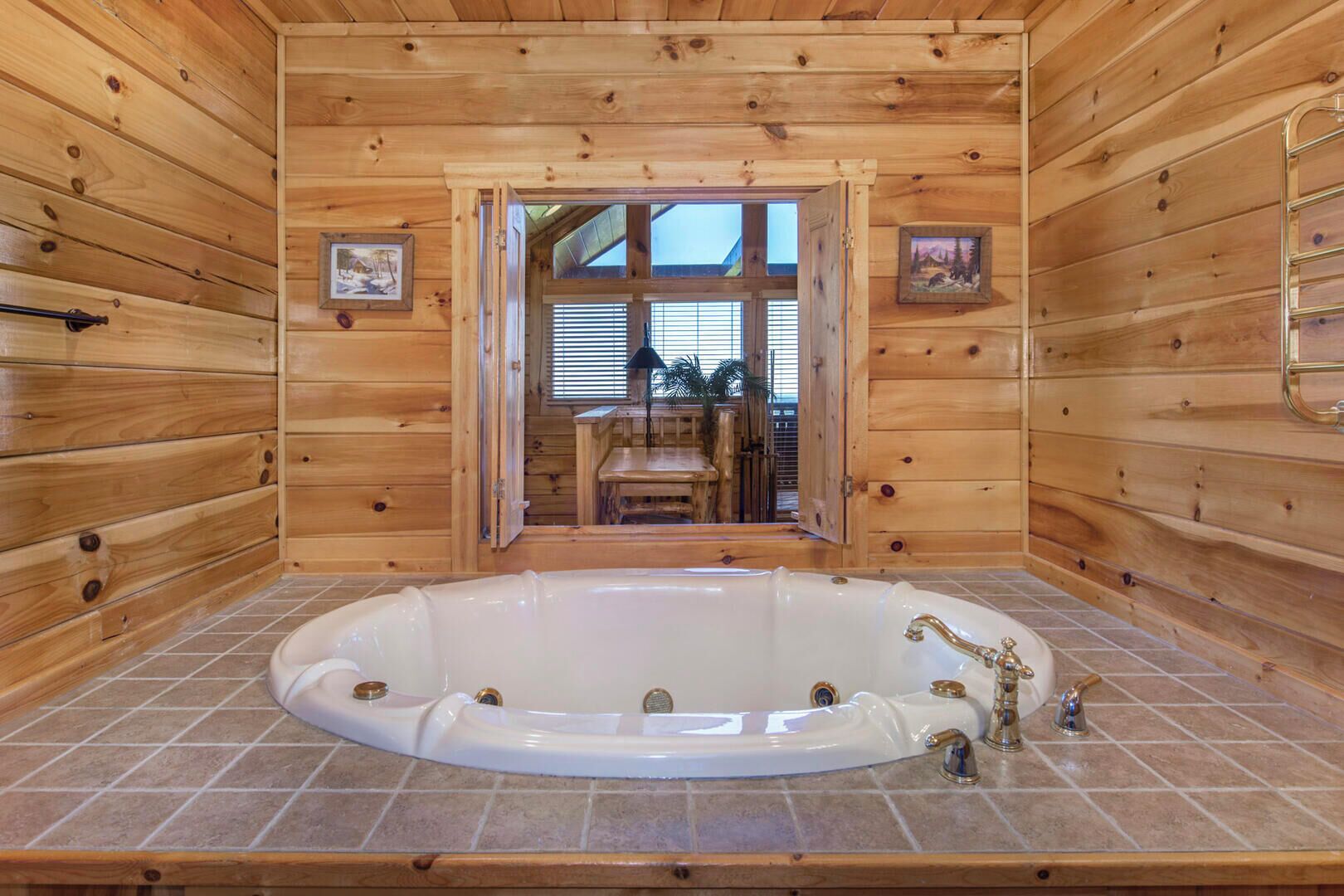A wooden cabin with a large bathtub, wooden walls, and a view through a door.