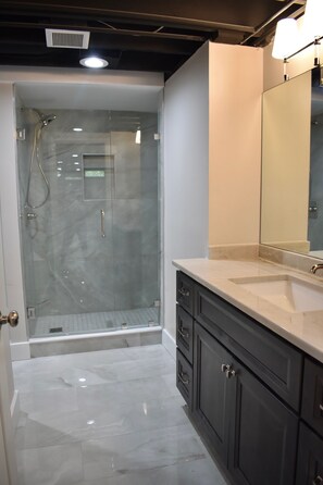 Shower, towels, soap, toilet paper