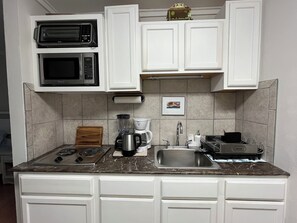 Fridge, microwave, stovetop, coffee/tea maker