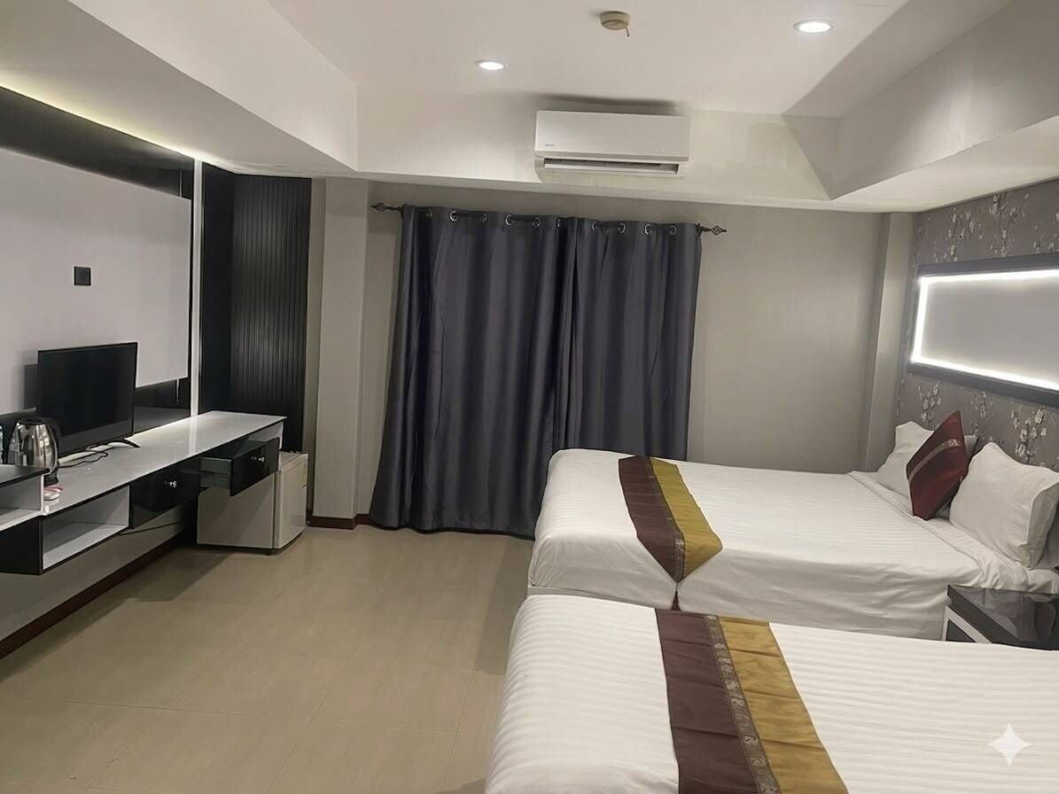 Chambre Triple Deluxe | Coffres-forts dans les chambres, Wi-Fi gratuit