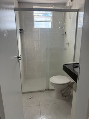 Shower, towels, soap, toilet paper