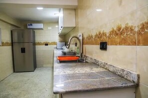 Junior Room, Balcony, City View | Private kitchen | Fridge, microwave, oven, stovetop