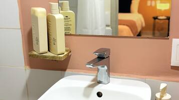 Shower, towels, soap, toilet paper