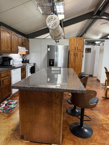 Unique camp style house with large wrap around deck.