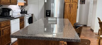 Unique camp style house with large wrap around deck.