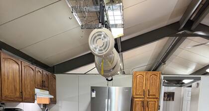 Unique camp style house with large wrap around deck.