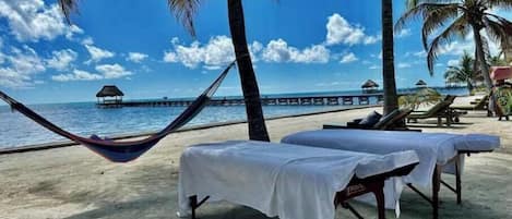 On the beach, sun-loungers, beach towels