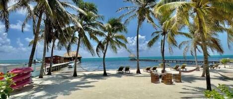 On the beach, sun loungers, beach towels