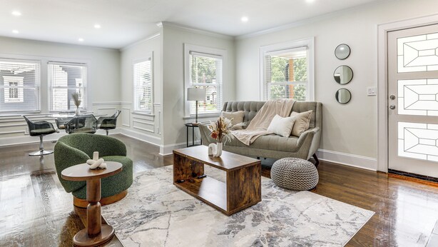 A modern living room with a green armchair, a round coffee table, and a grey sofa. - Modern & Fully Updated! ATL Home 4 Mi to Dtwn Fun (Atlanta)