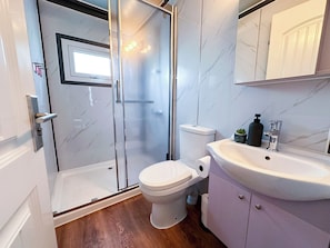 Shower, towels, shampoo, toilet paper