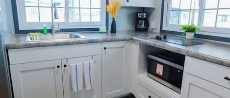 Fridge, microwave, stovetop, coffee/tea maker