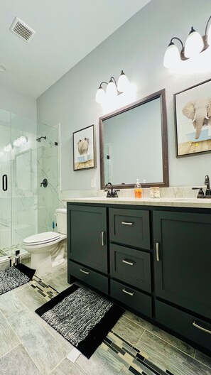 Shower, hair dryer, towels, soap