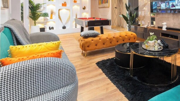 A modern living room with a pool table, a sofa, and a coffee table. - 4th Manor Shortlets (Lekki)