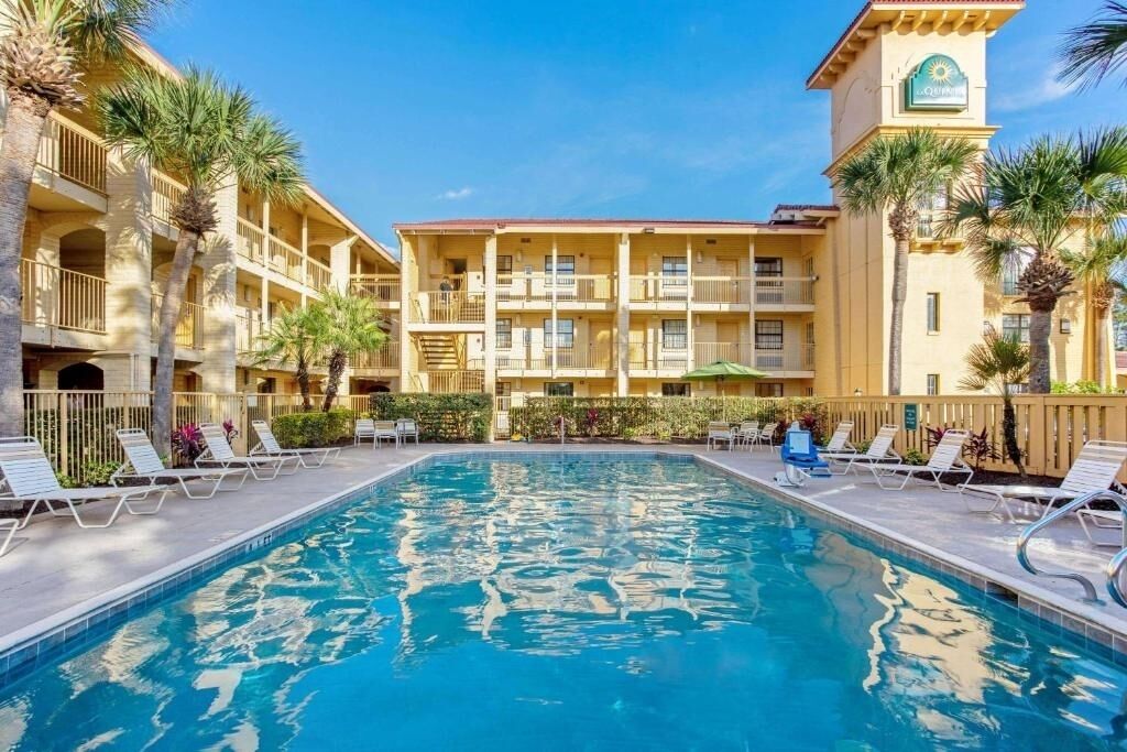 Dive into sunshine with sparkling pool and palm views.