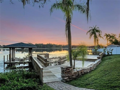 Terrace/patio. The American Dream House – Lakefront Luxury with 2 Heated Pools & Hot Tub