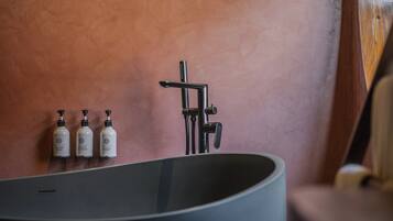 Separate bathtub and shower, hair dryer, slippers, towels