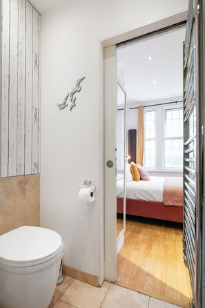 Shower, hair dryer, towels, toilet paper