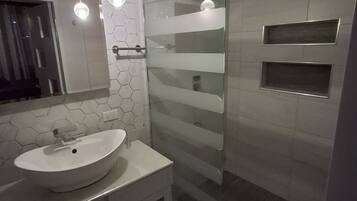 Shower, towels, soap, toilet paper
