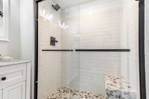 Shower, hair dryer, towels, soap