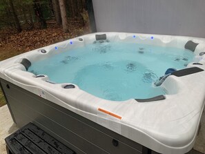 Outdoor spa tub - Lakefront Hideaway • Modern 2BR/2BA Cabin with Hot Tub • Near Wisconsin Dells (Wisconsin Dells)