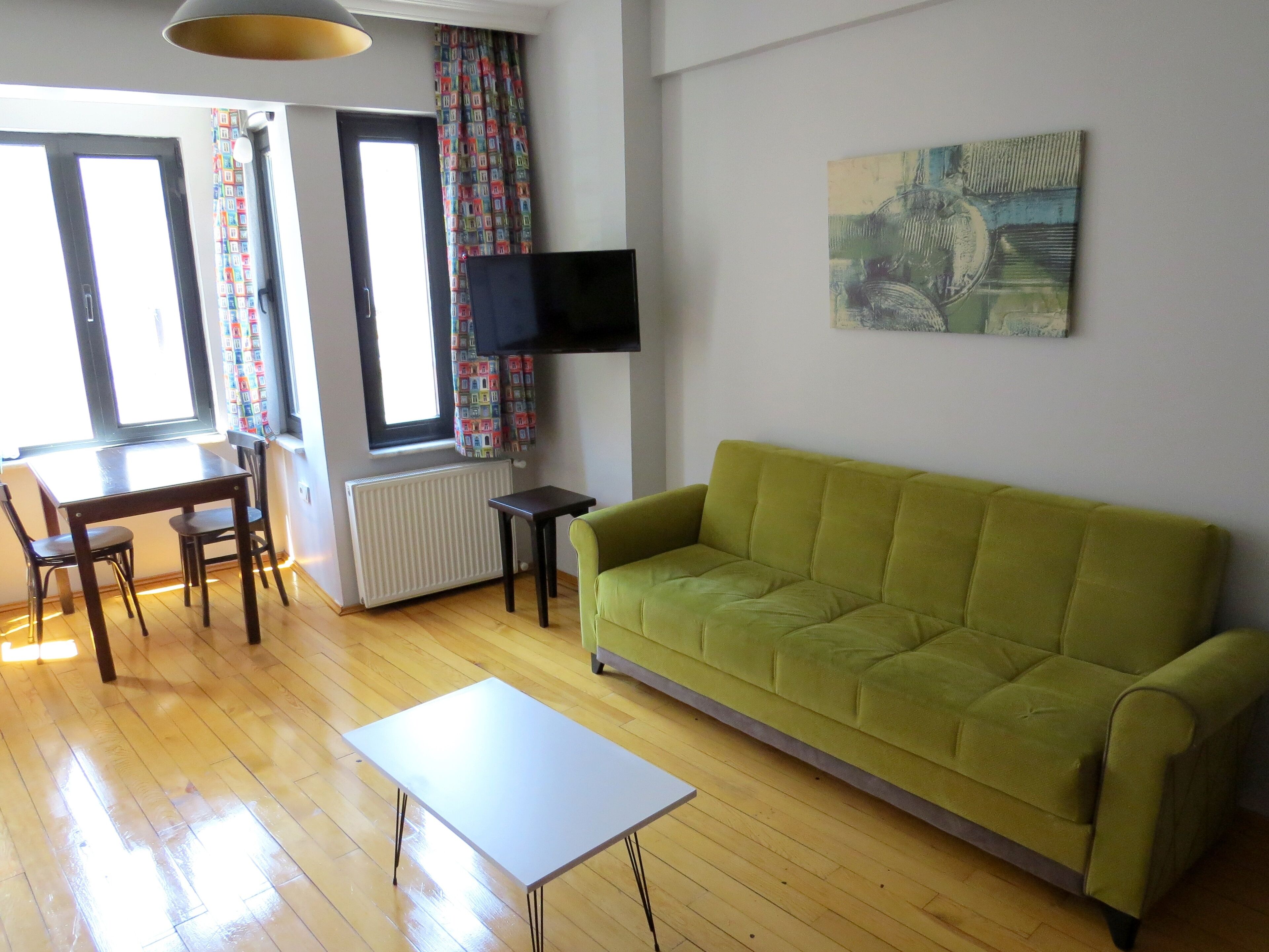 Deluxe Studio | Living area | Flat-screen TV